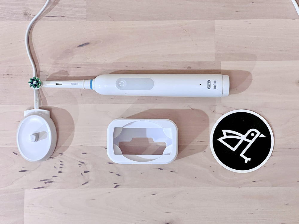 Reference image: Oral-B Pro 1000 charger shown for reference