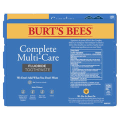 Person smiling after brushing with Burt's Bees Complete Multi-Care toothpaste