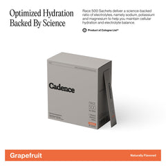 Cadence Race Grapefruit sachet dissolving in water for fast hydration and focus.