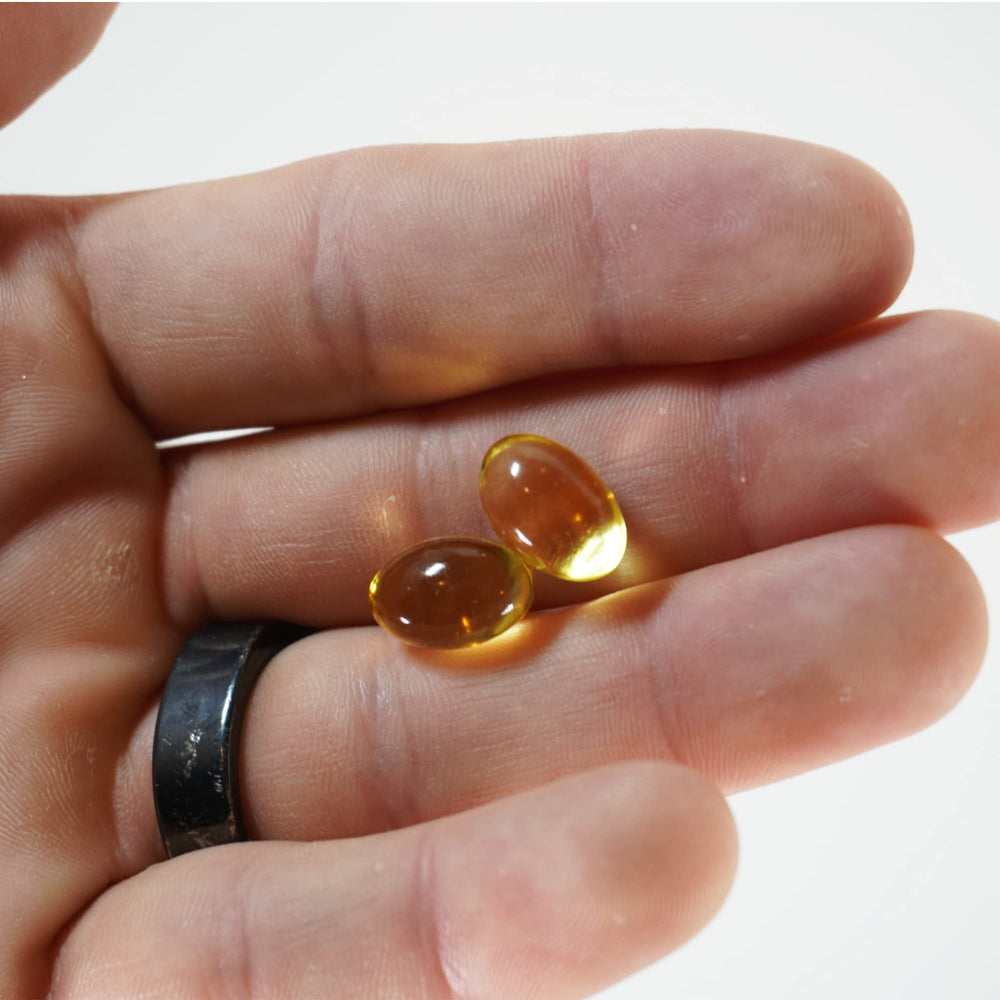 Capsules and glass bottle with product packaging