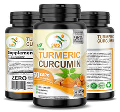 Hands holding turmeric capsules