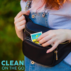 Person cleaning a camera lens with Care Check Lens Wipes