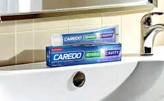 Two-tube CAREDO cavity reversal toothpaste package