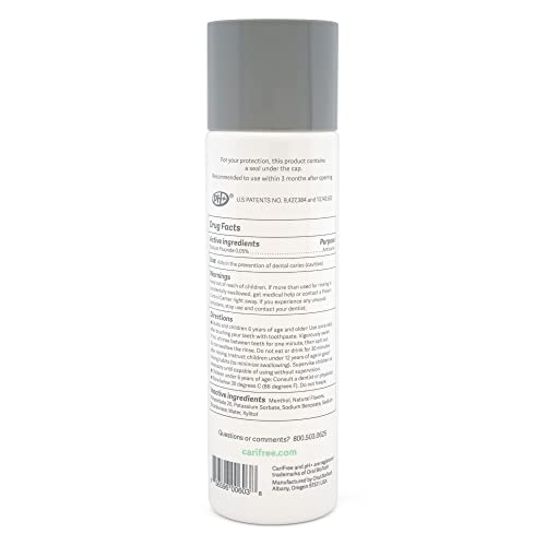 Close-up of person swishing CariFree Maintenance Rinse