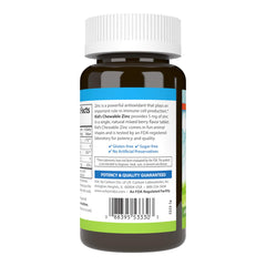 Close-up of an animal-shaped zinc chewable tablet in mixed berry flavor