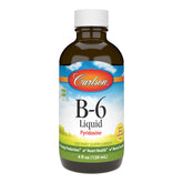 Carlson Labs Vitamin B-6 Liquid bottle on a kitchen counter, suggesting daily energy production support.