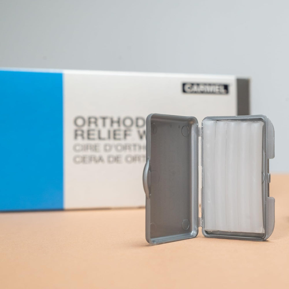 Open box showing four wax strips per pack