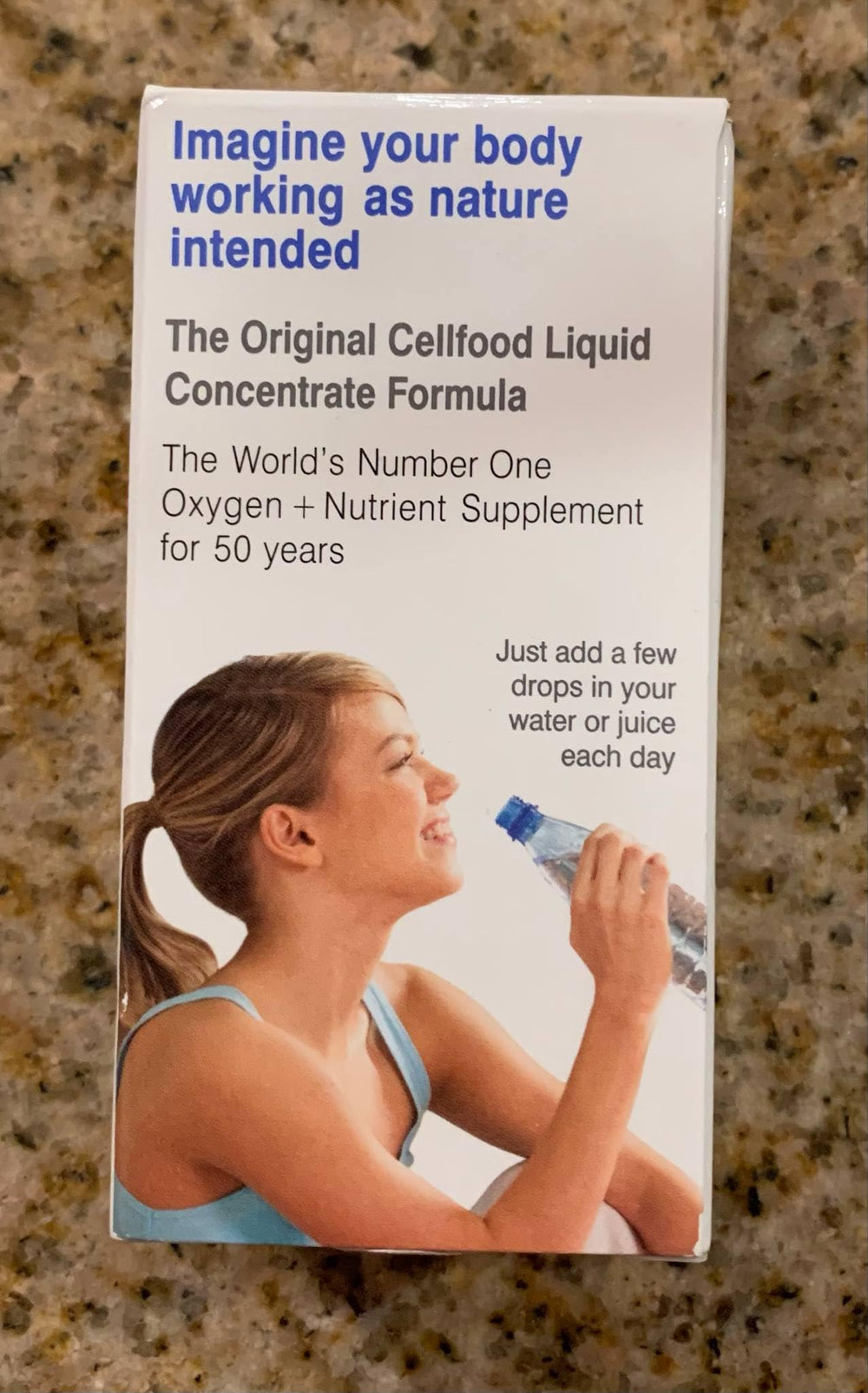 Cellfood Oxygen Boost with glass of water demonstrates easy hydration integration.