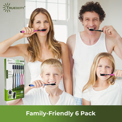 Activated charcoal toothpaste beside toothbrush