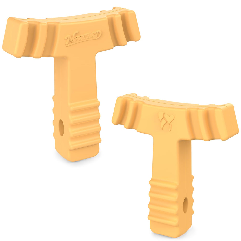 Yellow medical-grade silicone aligner chewies showing grooved bite zones