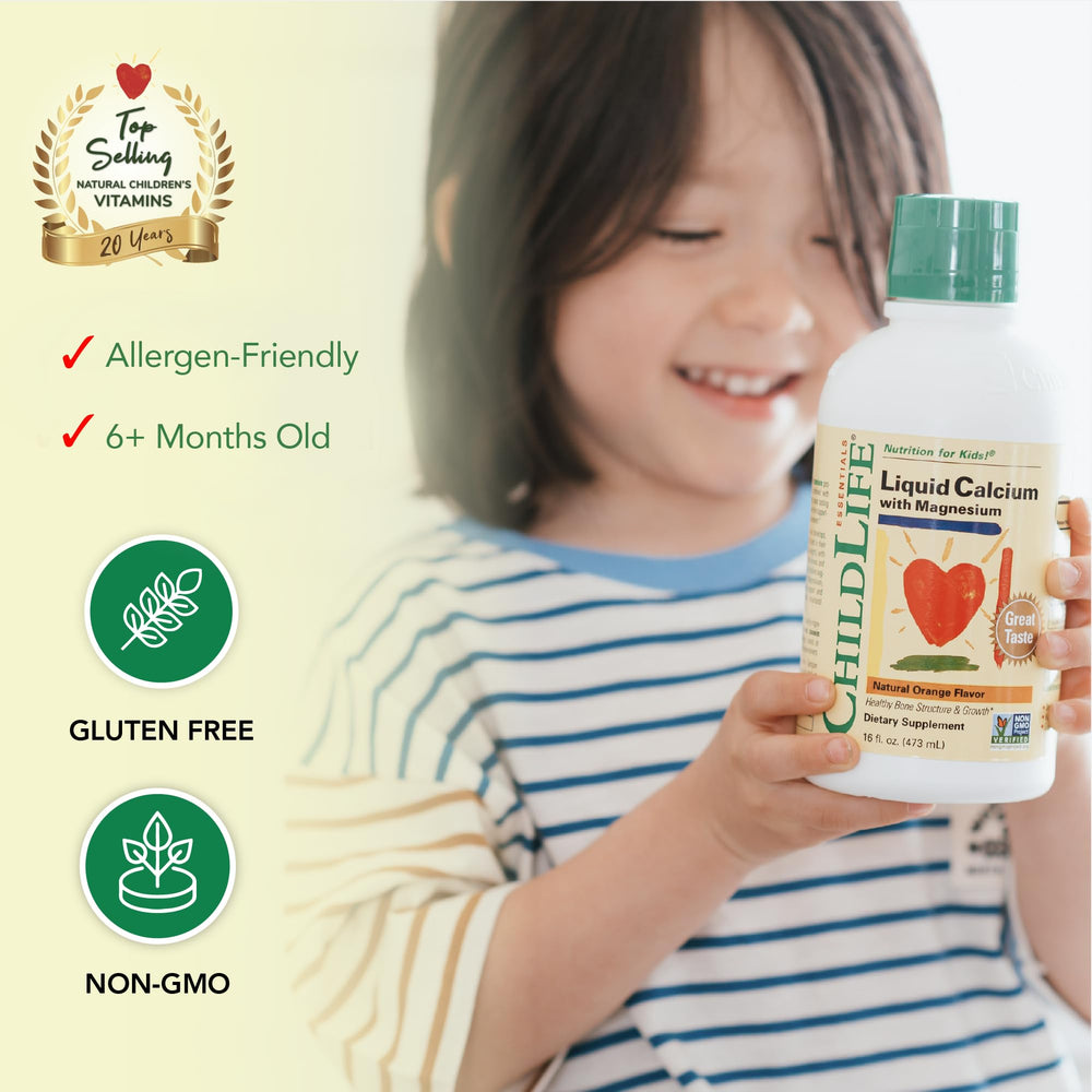 Dropper dispensing orange liquid calcium for children