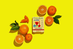 Natural orange flavor graphic with vitamin imagery