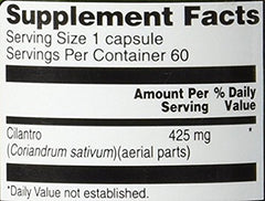 Close-up of cilantro (coriander) capsule labeled 425 mg