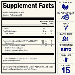 Citrus-flavored turmeric drink shot with lemon and pomegranate