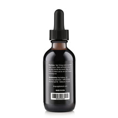 Close-up of dropper releasing fulvic minerals