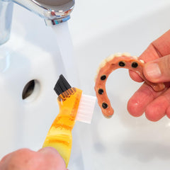 COHEALI 4-pack denture cleaning brushes in bathroom setting
