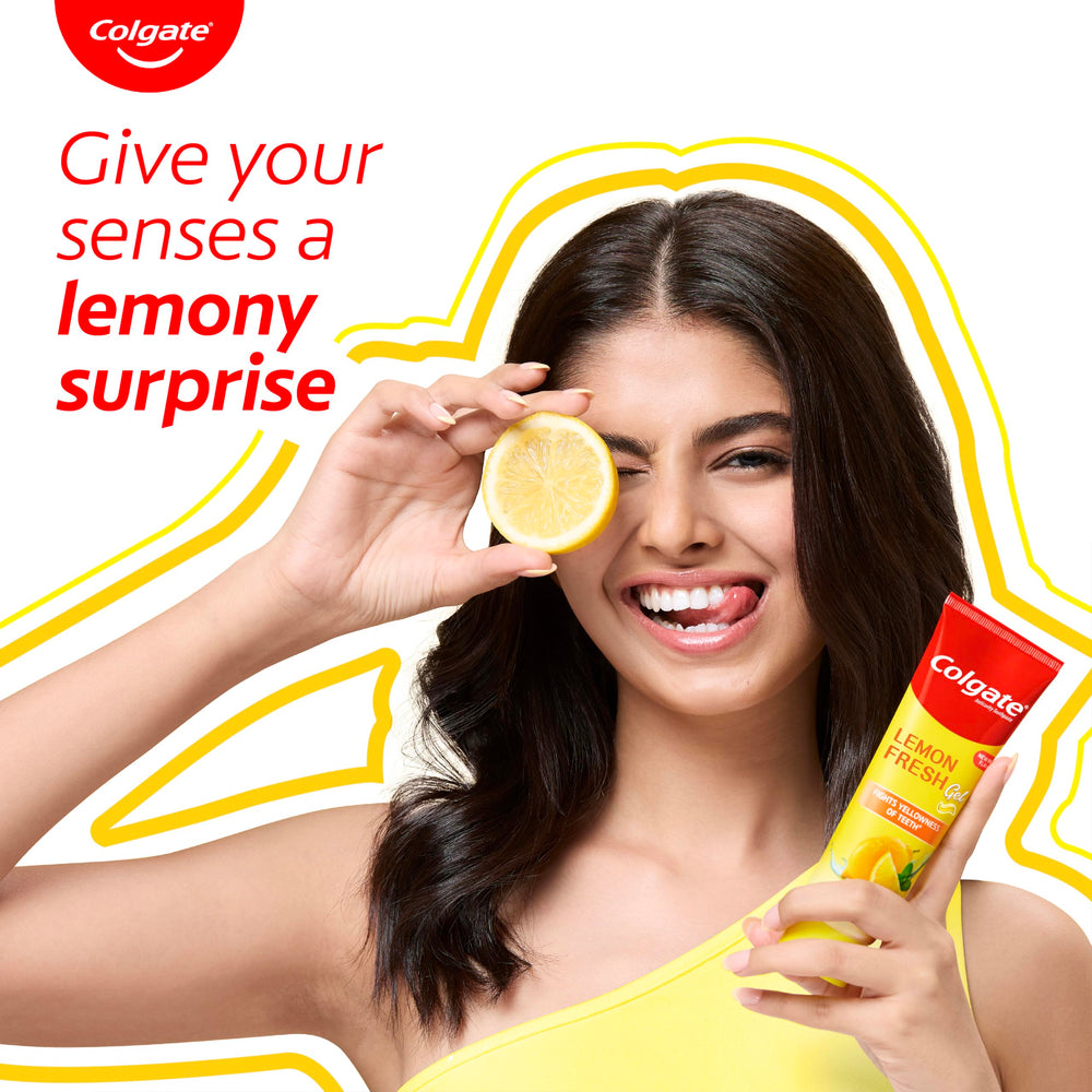 Tube of Colgate Lemon Fresh Gel Toothpaste with lemon garnish