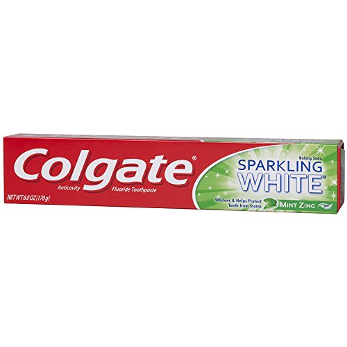 Smiling person showing sparkling white teeth after brushing