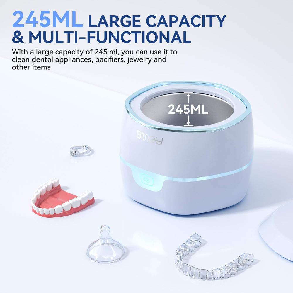 Compact ultrasonic cleaner operating quietly at 40dB with 245ml pod