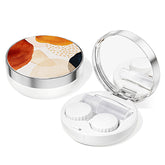 Open travel compact contact lens case showing compartments