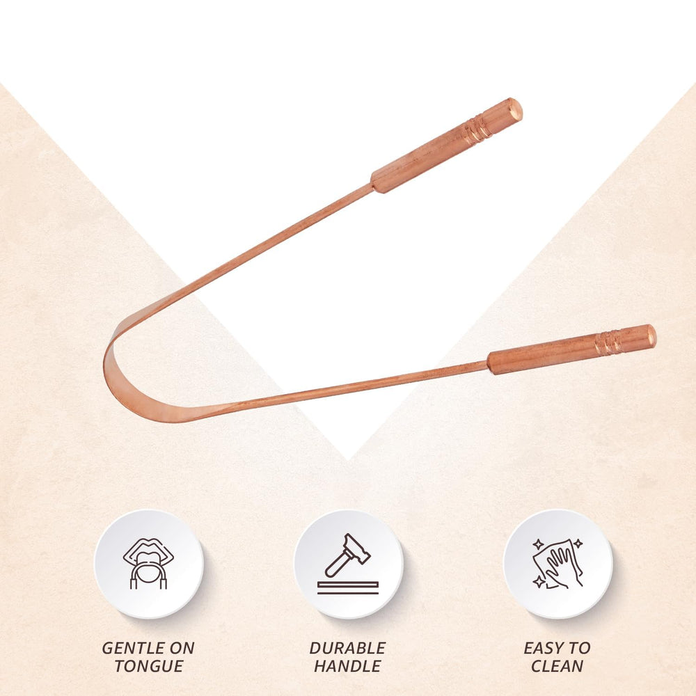 Copper tongue scraper on white background highlighting traditional design