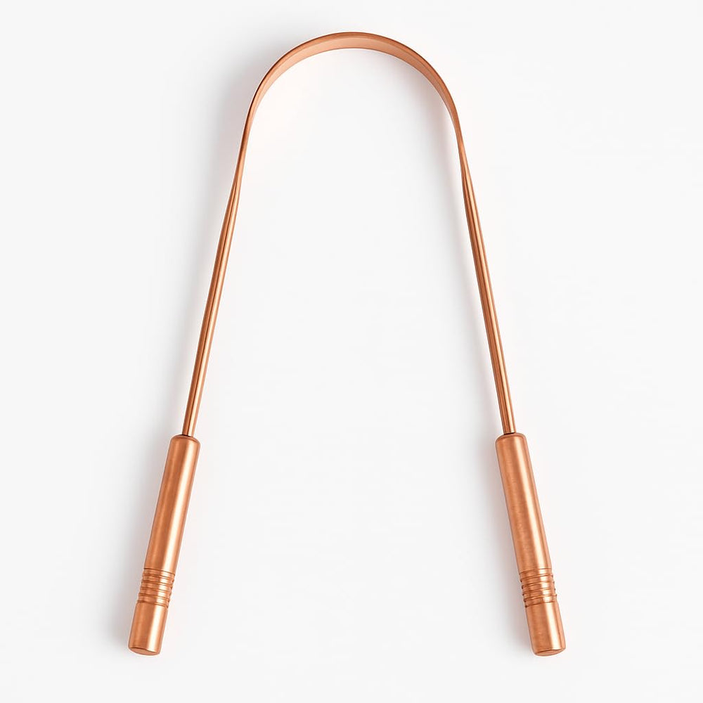 Close-up of copper tongue scraper showing U-shaped design