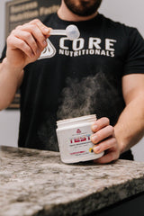 Core Nutritionals Test Vitality ingredient pile including Ashwagandha and DAA