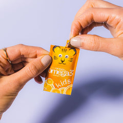 Tropical orange flavor illustration for Coromega Kids Omega-3