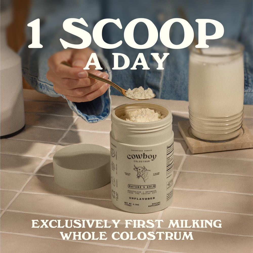 Glass of water with Cowboy Colostrum Powder being stirred