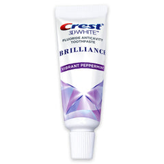 Crest 3D White Brilliance toothpaste tube close-up, Vibrant Peppermint flavor, travel size 0.85 oz (24 g)