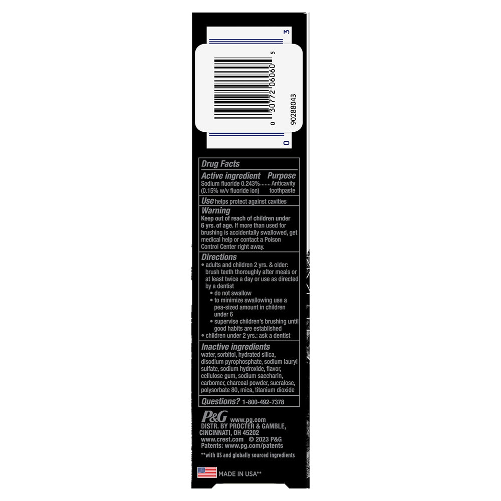 Toothbrush and Crest 3D White Whitening Therapy Charcoal toothpaste with mint flavor