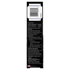 Toothbrush and Crest 3D White Whitening Therapy Charcoal toothpaste with mint flavor