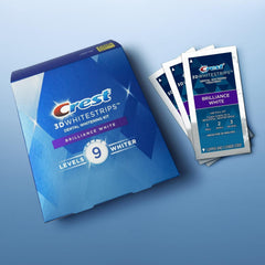 User applying Crest 3D Whitestrips Brilliance White upper and lower strips