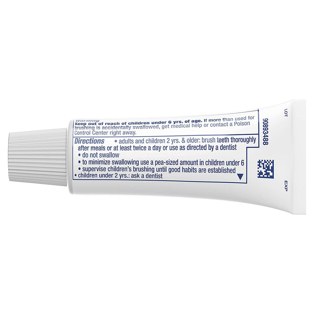 Toothpaste on a toothbrush with minty foam