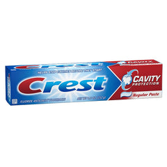 Five Crest toothpaste tubes arranged in display