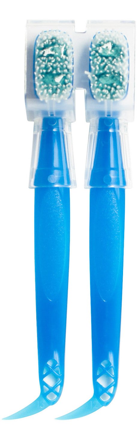 Travel-sized disposable toothbrush with interdental pick
