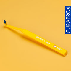 Soft bristles visible on the Curaprox toothbrush