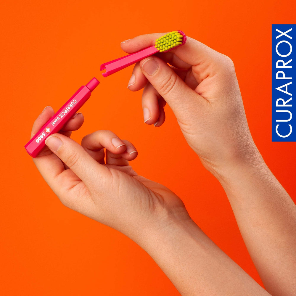 Curaprox refill heads with orange-yellow accents
