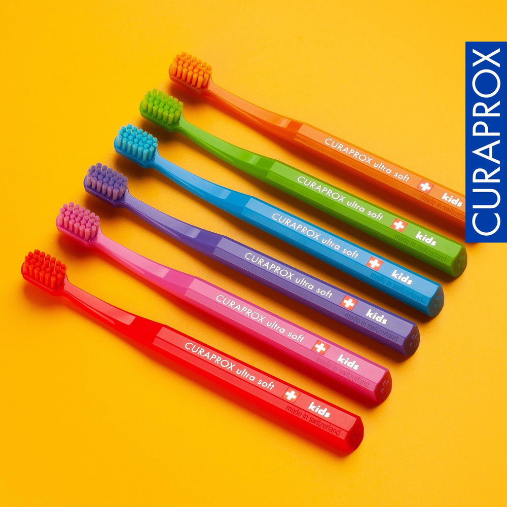 Child using Curaprox CS Kids toothbrush