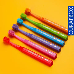 Child using Curaprox CS Kids toothbrush