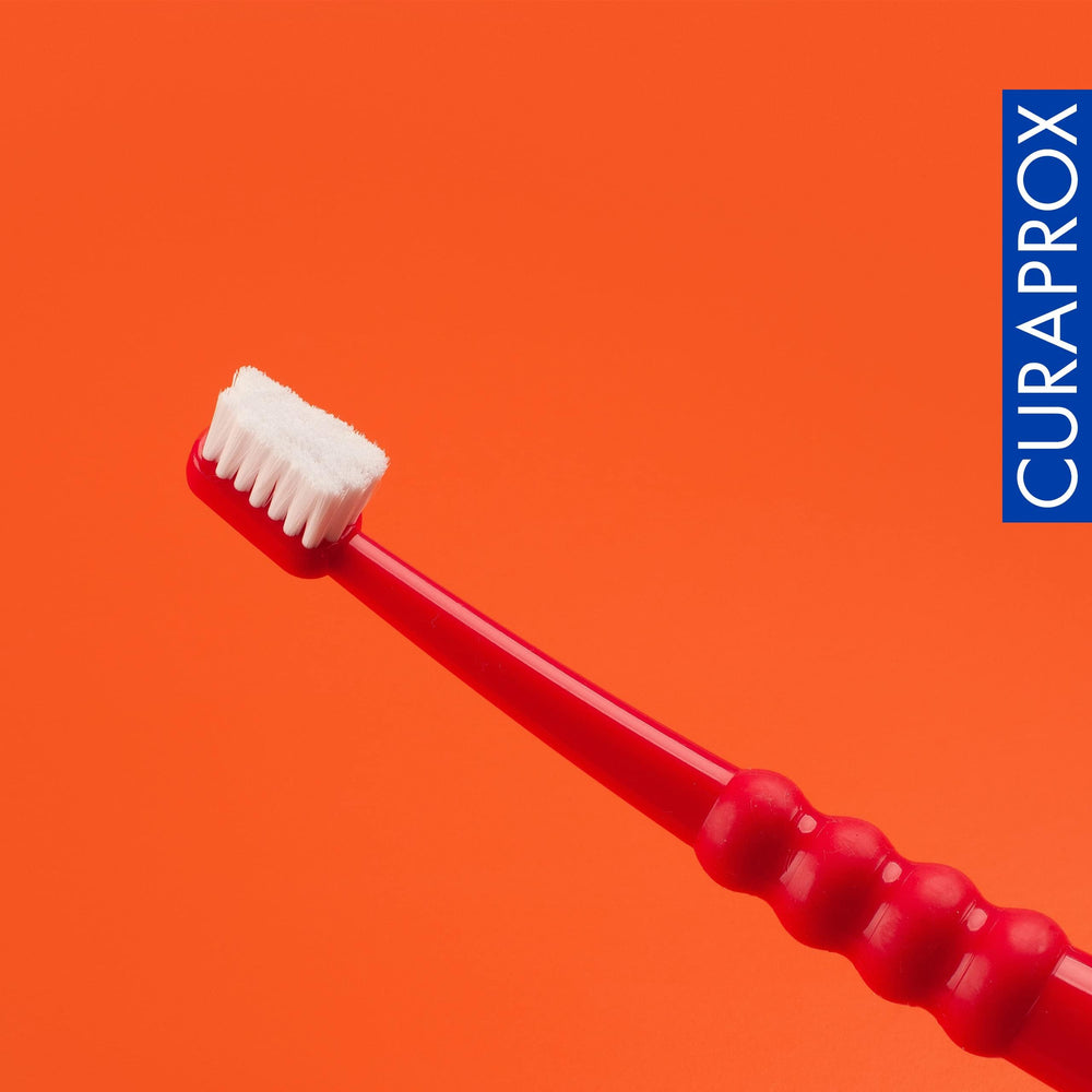 Two Curaprox CS Surgical Toothbrushes shown in packaging
