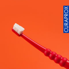 Two Curaprox CS Surgical Toothbrushes shown in packaging