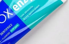 Close-up of Curaprox Enzycal toothpaste tube