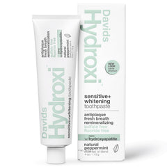Front view of Davids Hydroxi toothpaste tube on white background