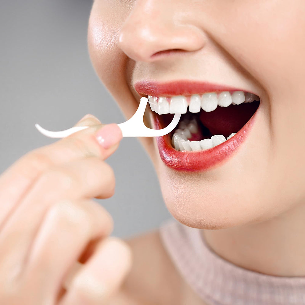 Integrated toothpick end on the floss dispenser handle