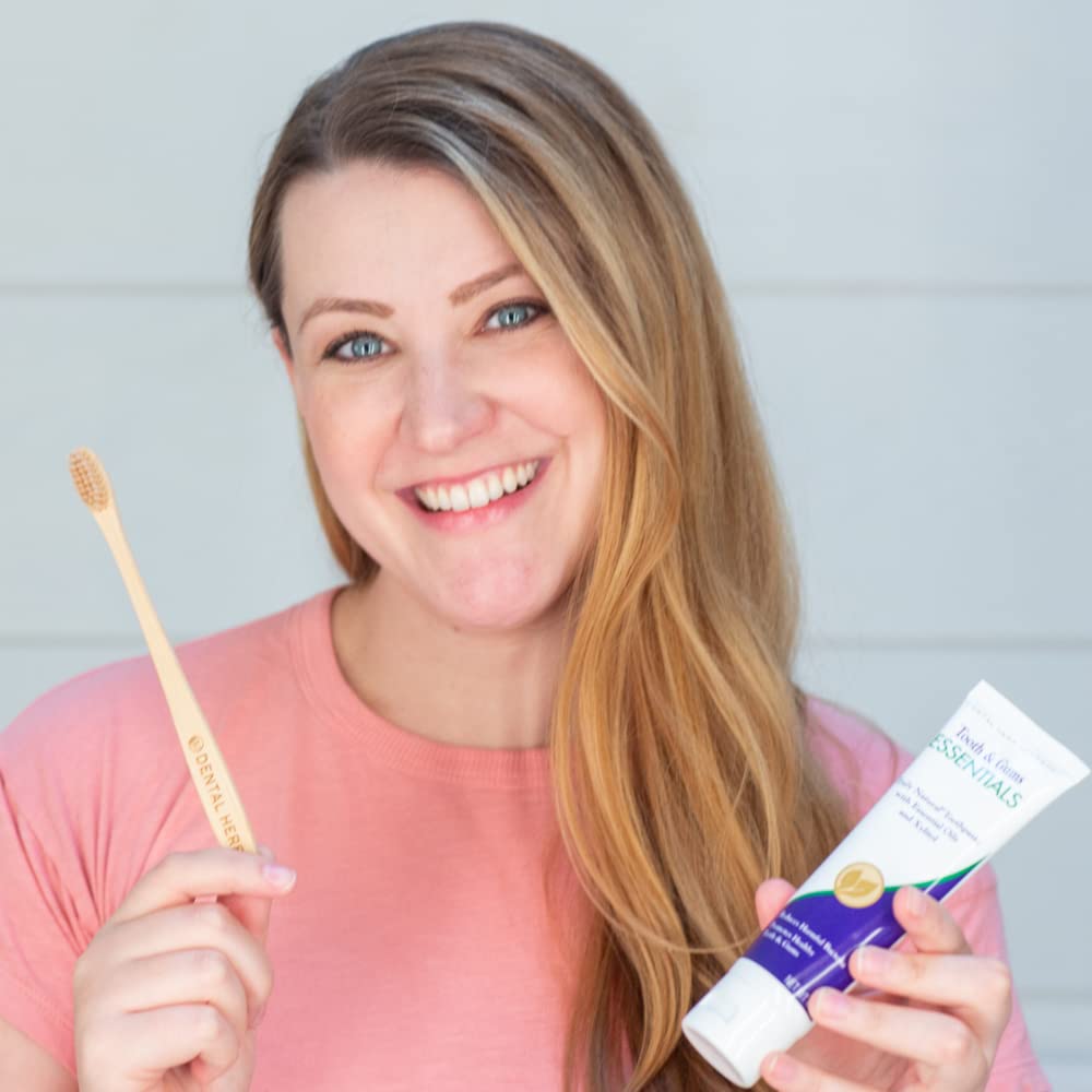 Lifestyle image of person brushing teeth with Essentials Toothpaste