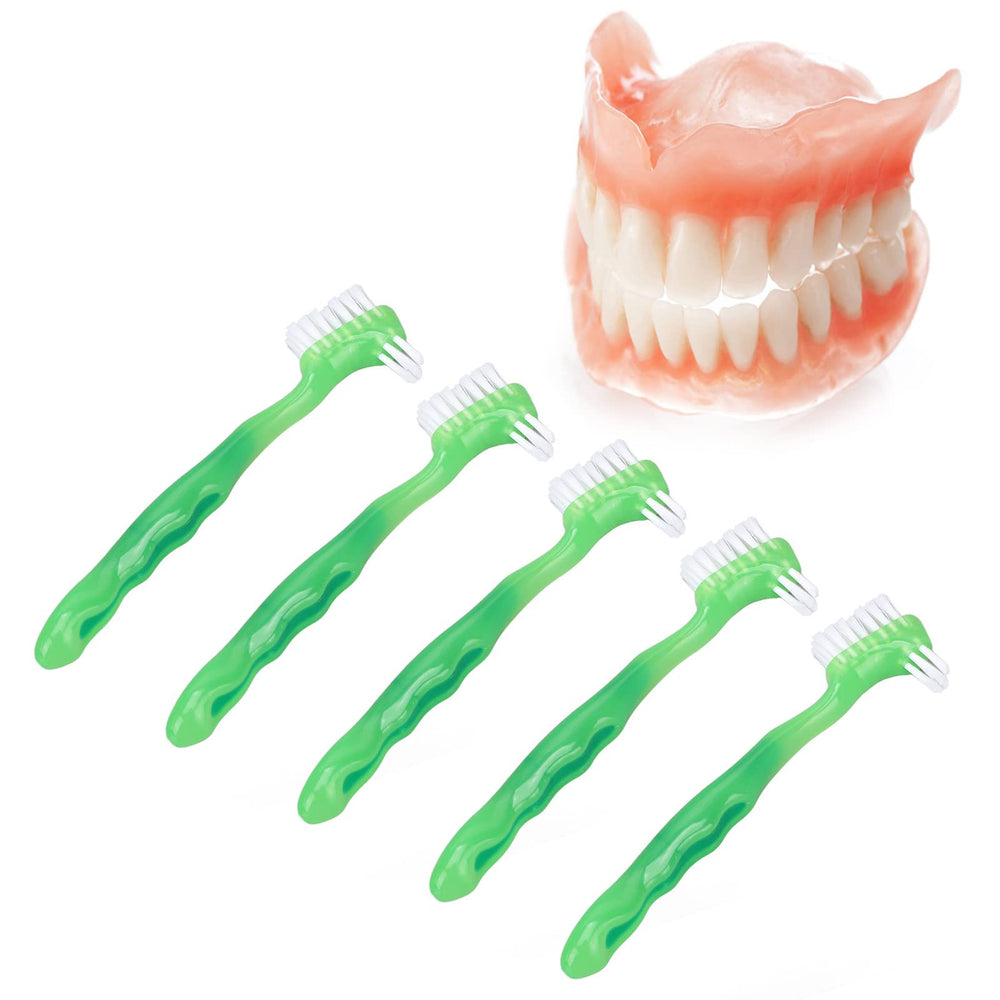 Ergonomic handle of a denture brush