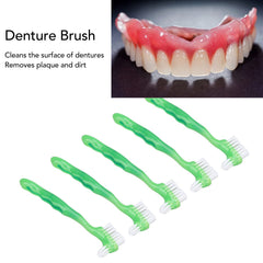 Denture cleaning in progress showing plaque removal