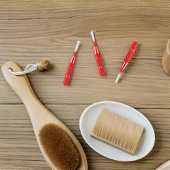 Blue interdental brush poised for braces cleaning