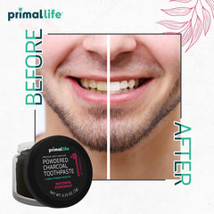Peppermint essential oil bottle beside toothpowder
